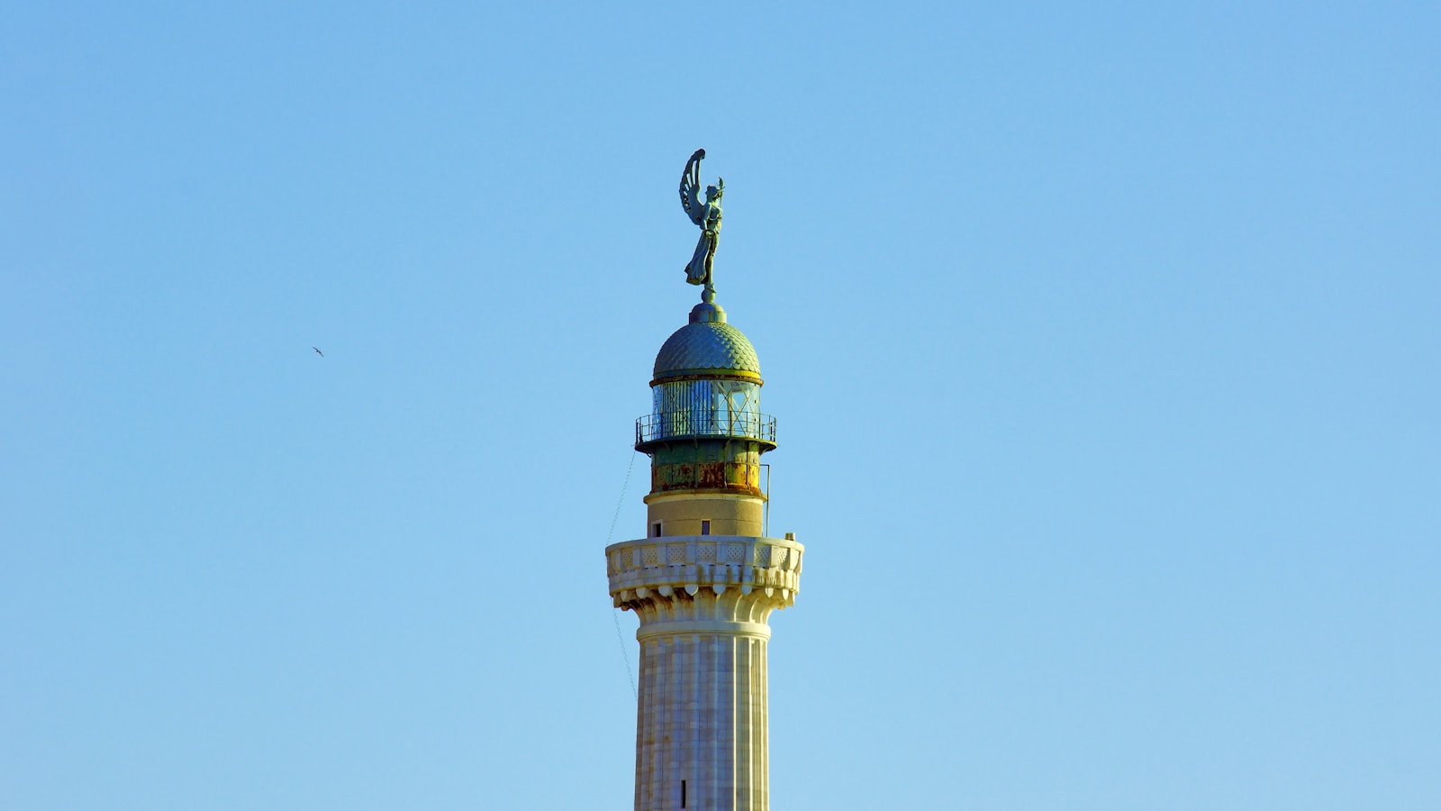 brown and green tower under blue sky during daytime