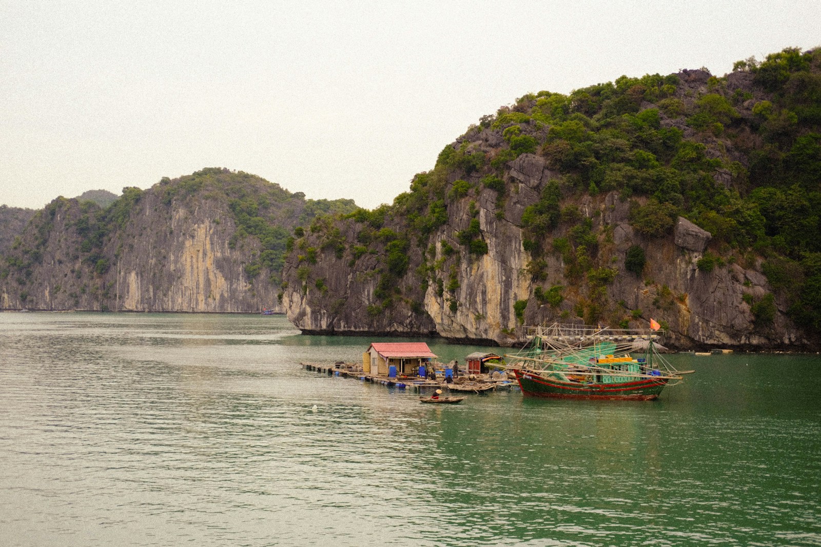 a group of boats floating on top of a body of water