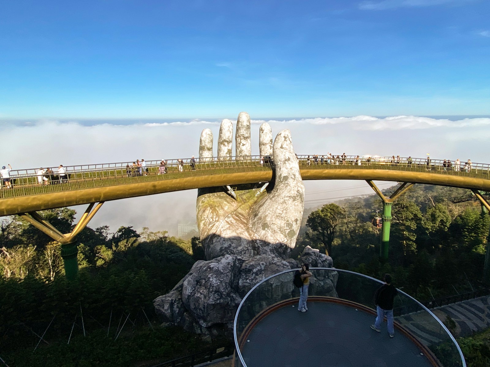 Golden bridge, held by giant hands in vietnam.